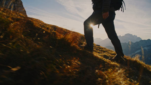 istock Hiker in Full Gear Trekking at Sunset 2174757709
