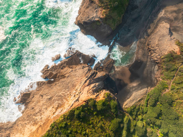 istock Ocean waves crash on a rocky beach. 2174758592