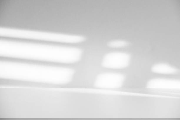 istock Studio style background wall decoration presentation uses white tones. with shadows cast from a nearby window, concept creating a decorative backdrop. 2174765569