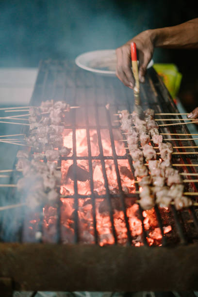 istock Satay, or sate in Indonesian spelling, is a Southeast Asian form of kebab made from seasoned 2174765708