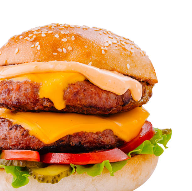 istock Delicious double beef burger with melted cheese and vegetables on white background 2174769031