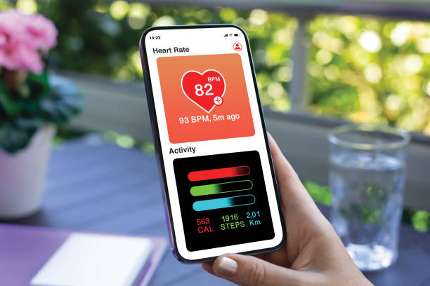 istock woman hand hold phone with app heart and activity screen 2174774452