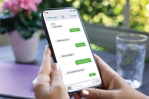 istock woman hands hold phone with app messenger on screen cafe 2174774455