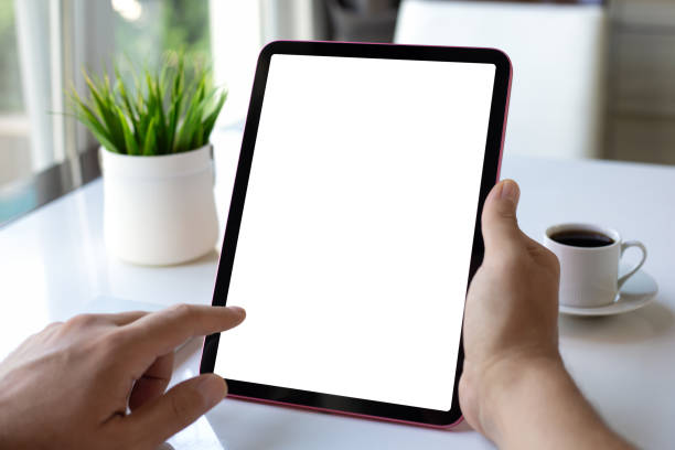 istock male hand holding computer tablet with isolated screen in cafe 2174774486