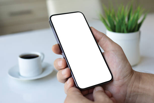 istock male hand holding phone with isolated screen background white office 2174775007
