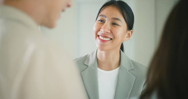 istock Smiling Businesswoman Engaging in a Friendly Conversation. 2174783320