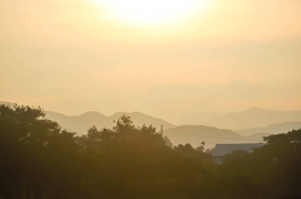 sky ,tree , mountain and house background or a house and tree or forest