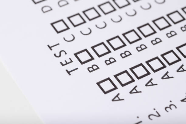 ABCD test with answers and tick boxes on paper close up isolated