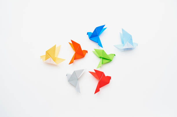 istock Flock of pigeons made from folded paper (origami) 2174786325