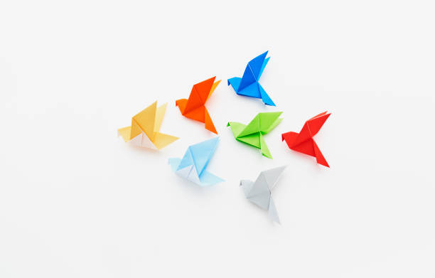 istock Flock of pigeons made from folded paper (origami) 2174786327
