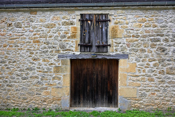 Seillans, France - July 3, 2014: A rustic building along an alleyway in the provencal village of Seillans, France