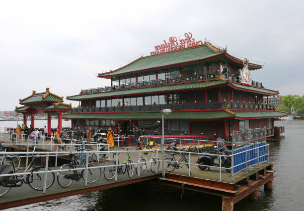 Amsterdam, Netherlands-June 11,2016:Unidentified Asian People and  Monks visiting Famous Floating Sea Palace Chinese Restaurant