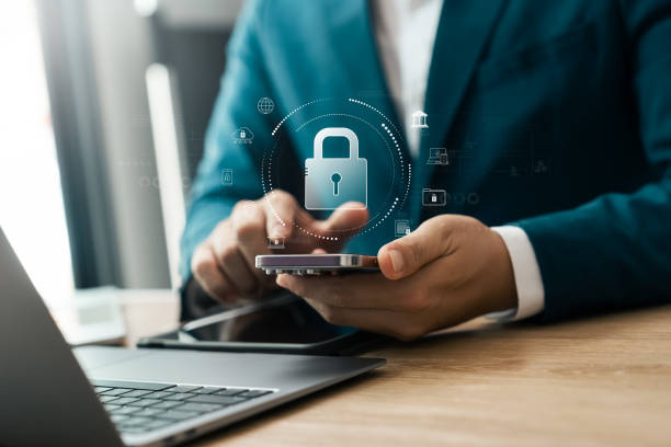 istock Cyber ​​security technology, data protection, businessman using mobile phone and laptop with padlock 2174795969