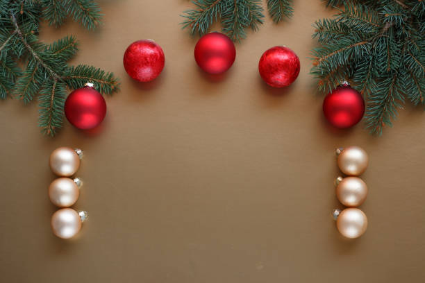 istock Gold and red Christmas baubles on a gold background. 2174806627
