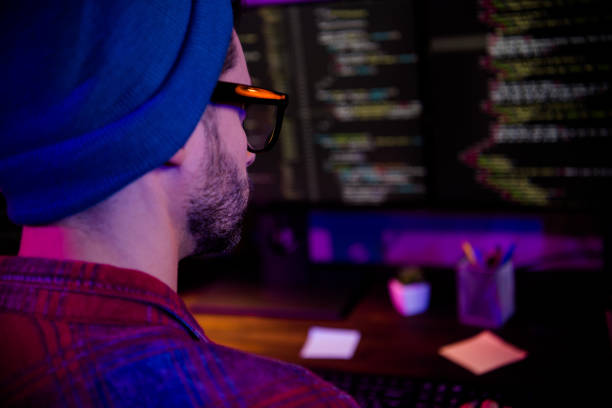 istock Photo of cool pensive programmer wear spectacles hat working lonely indoors workplace workshop home 2174808342