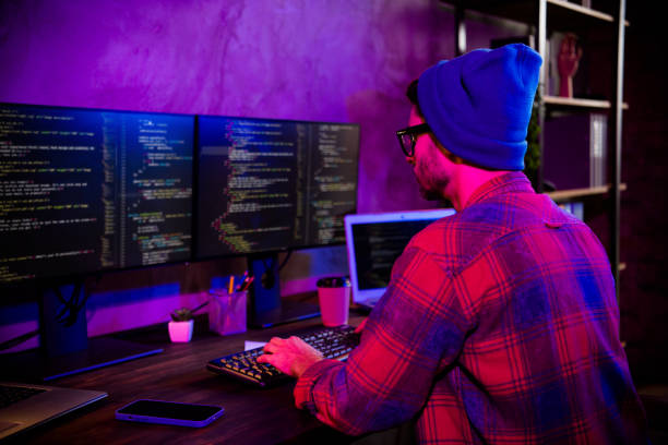 istock Photo of confident cool programmer wear hat spectacles typing framework indoors workplace workshop home 2174808358