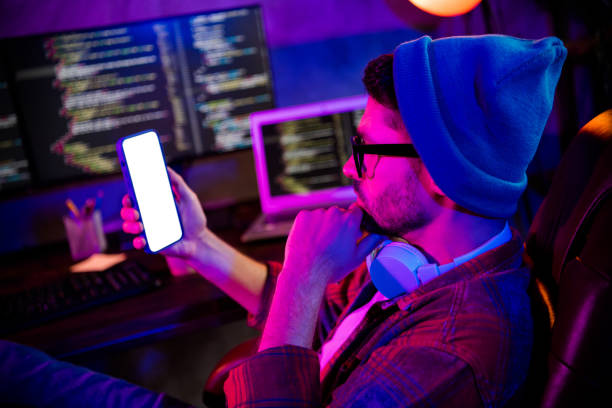 istock Photo of confident thoughtful guy dressed glasses hat typing twitter telegram facebook device empty space indoors workstation workshop home 2174808823
