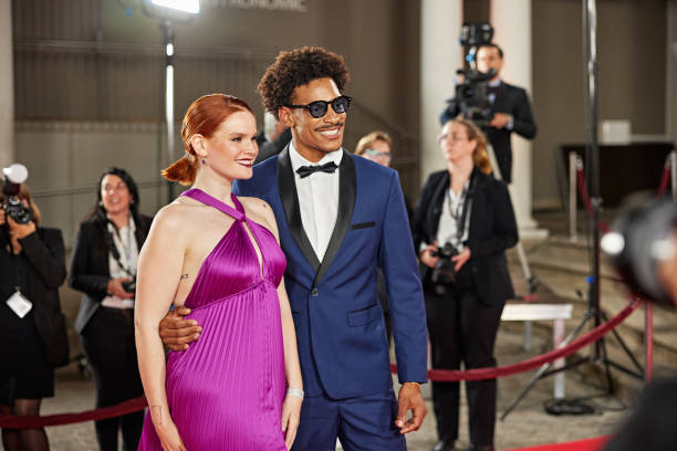 istock Celebrities posing for press pen photos at red carpet event 2174814596