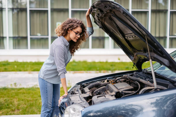 istock Young Woman Having Car Problems On The Street 2174814781