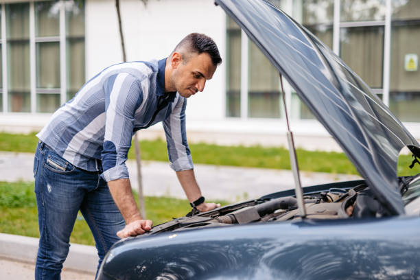 istock Mid-Adult Man Having Car Problems On The Street 2174814823