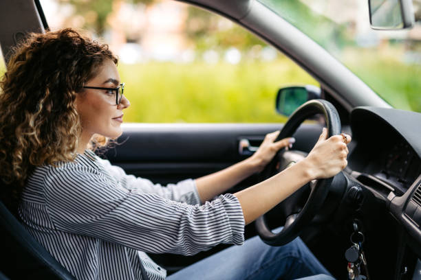 istock Young Woman Driving A Car 2174815698
