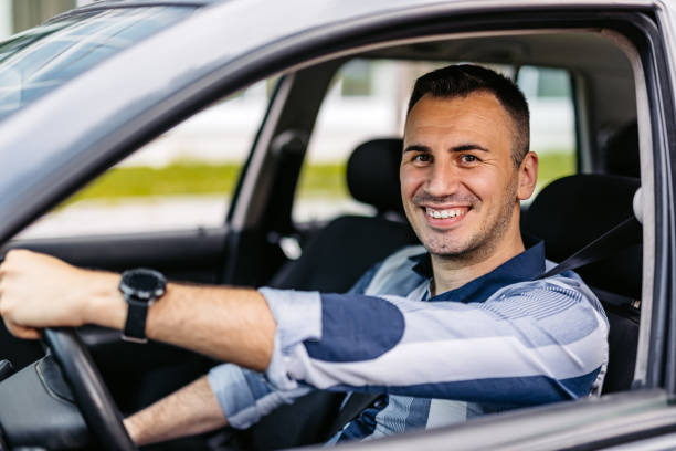 istock Mid-Adult Man Driving A Car 2174816667