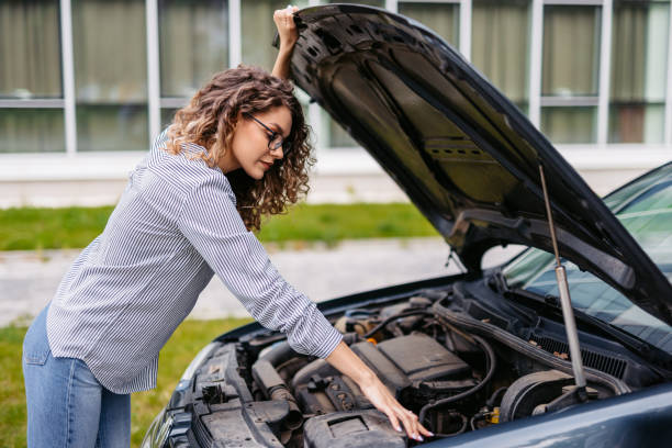 istock Young Woman Having Car Problems On The Street 2174816767