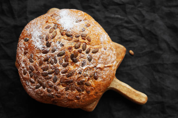 istock Fresh grain bread on a wooden board 2174828837