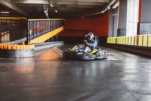 istock Go-Kart Racer in Action on Indoor Track 2174832981