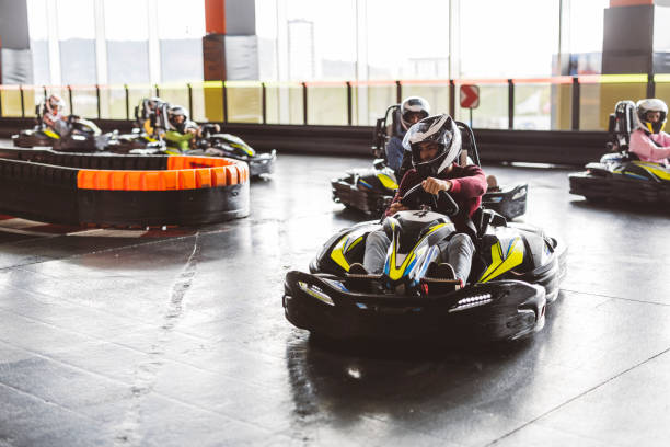 istock Go-Kart Racers Turning Corner on Indoor Track 2174833101
