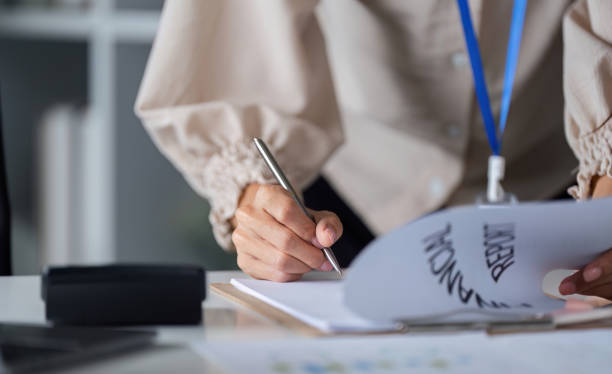 istock Determined Business Woman Working on Financial Report in Modern Office Setting 2174838745