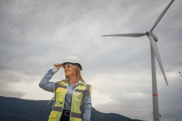 istock A confident and skilled female engineer working at a wind farm, she is a dedicated professional in the renewable energy sector, committed to promoting sustainability through teamwork and innovation 2174839940