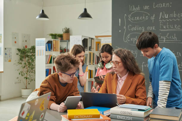 istock Group of Children Talking to Teacher 2174839971
