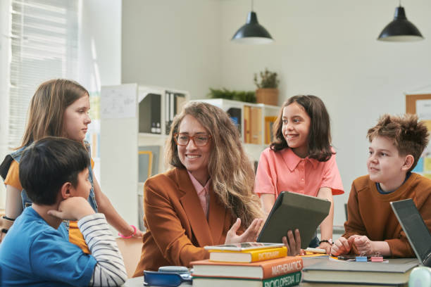 istock Teacher Enjoying Class with Group of Children 2174840015
