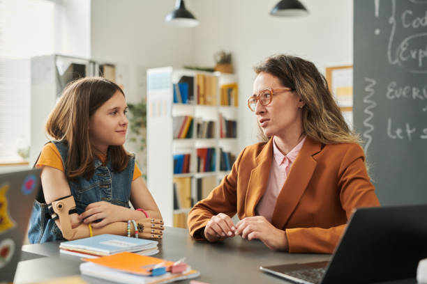istock Caring Teacher Talking to Girl 2174840050