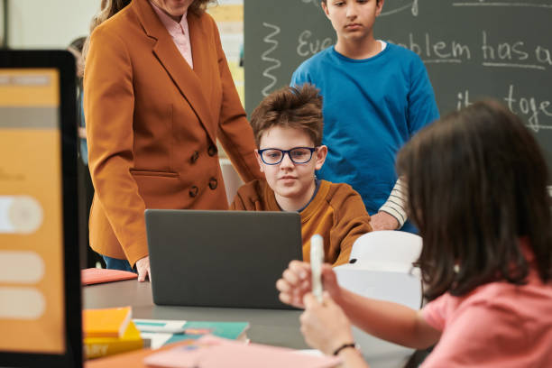 istock Funny Boy Wearing Glasses using Laptop 2174840178