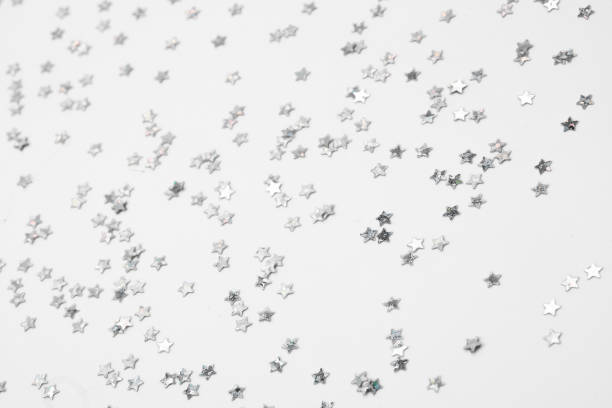 istock sparkles silver stars on white background with text place- Image 2174840319
