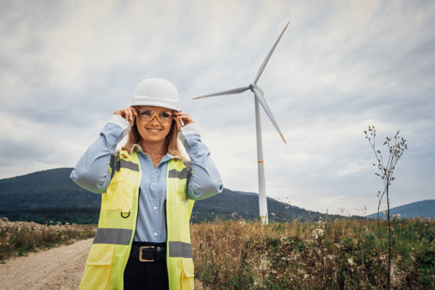 istock A confident female engineer excels at a wind farm, demonstrating her engineering skills, dedication to sustainability, and strong leadership in a challenging outdoor construction setting 2174840785