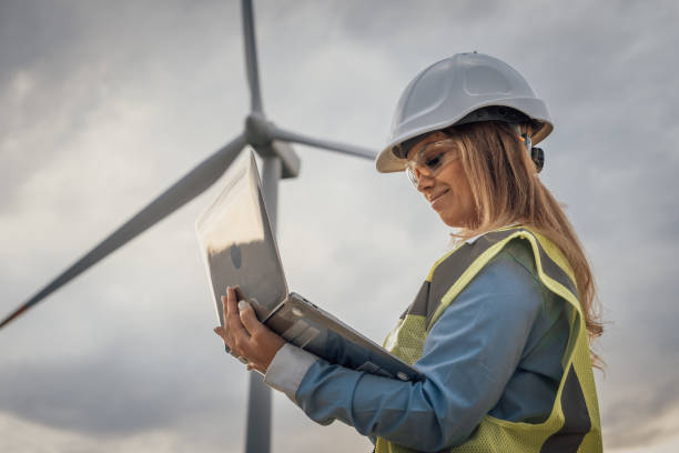 istock A skilled female engineer analyzes data at a wind turbine site, demonstrating her expertise in merging engineering principles with sustainable practices through innovative solutions and teamwork 2174842156