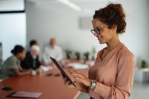 istock Businesswoman using a tablet during a conference meeting 2174842708