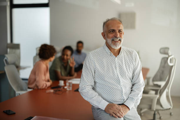 istock Man expresses joy with colleagues in office environment. 2174843592