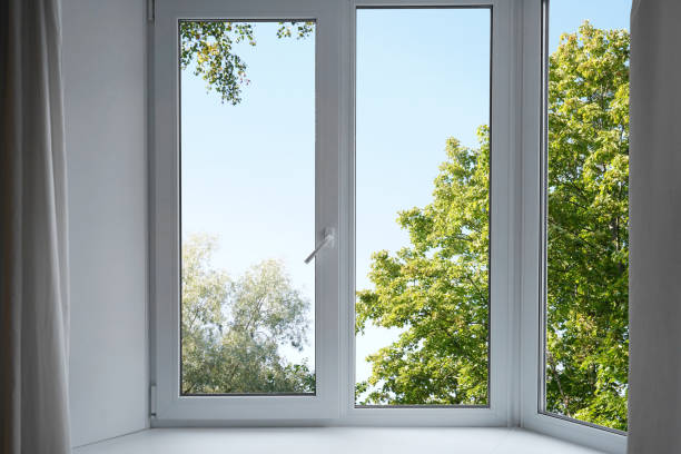 istock View from the window on the garden green trees . 2174844867
