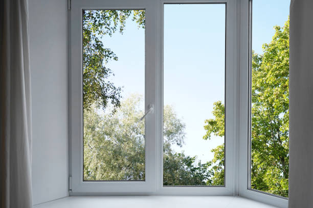 istock View from the window on the garden green trees . 2174845153