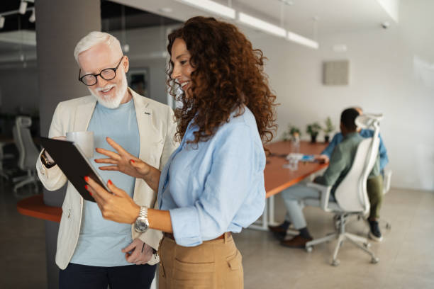 istock Professional discussion between colleagues in an office 2174847051