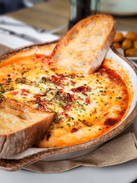 istock Typical italian food. Provolone plate with tomato sauce. 2174847289