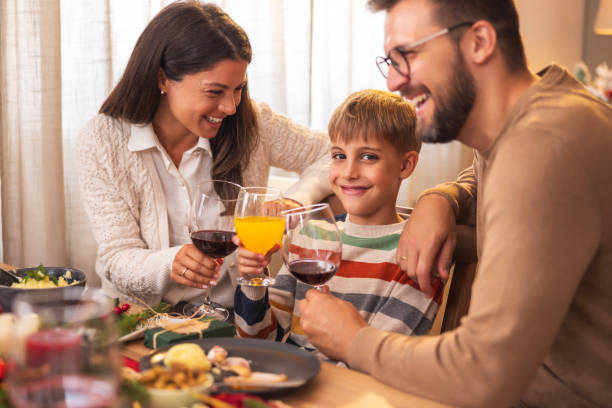 istock Parents making a toast with son while having Christmas dinner 2174850878