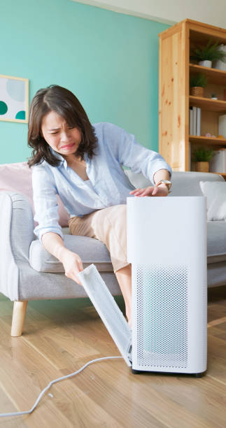 istock woman check dirty air purifier 2174853557