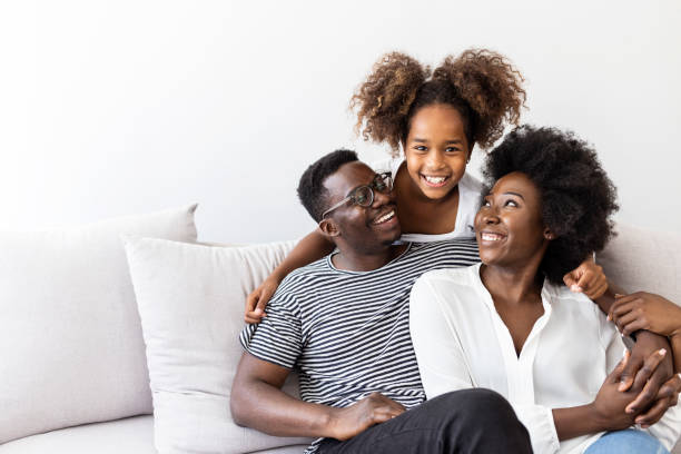 istock Happy Family Relaxing Together On Comfortable Sofa 2174859010