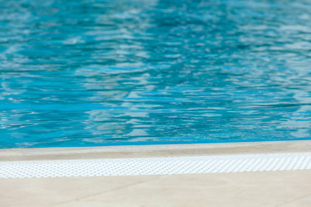 istock Blue water surface of swimming pool on sunny day 2174861337