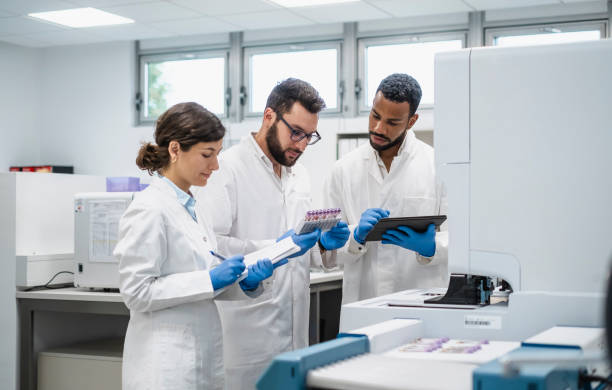 istock Diverse Team of Scientists Using Tablet for Research in Lab 2174865795